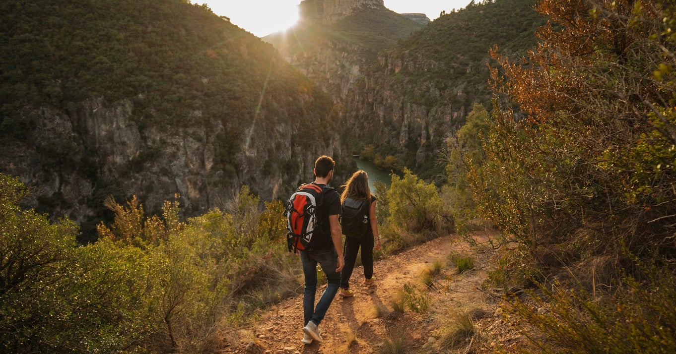 Couple walking in the mountains during sunset