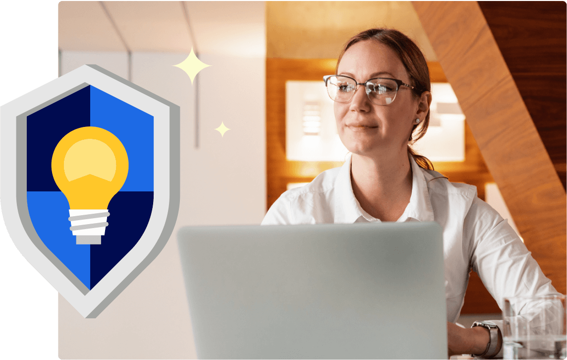Person on a laptop next to an illustration of a shield with a lightbulb on it.